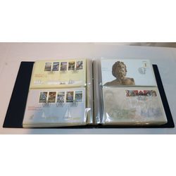 uni safe fdc album filled with 98 different first day covers that range from 1993 to 1999