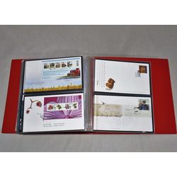 red unisafe fdc album with 101 different official canada post first day covers from january 2007 to may 2010